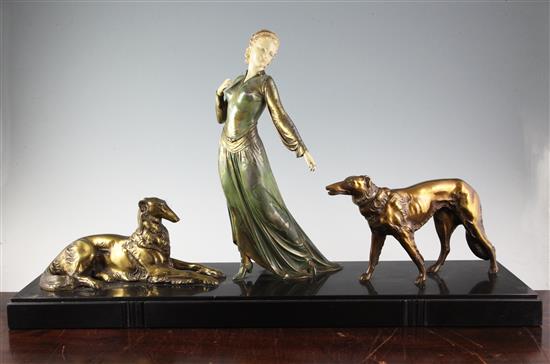 Roggia. An Art Deco painted and bronzed spelter group of an elegant lady and two Borzoi, length 29.5in.